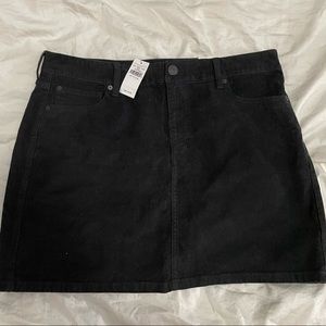 Corduroy black skirt with tags.